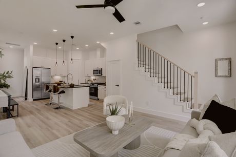 Open living area and staircase at Marcella Estates