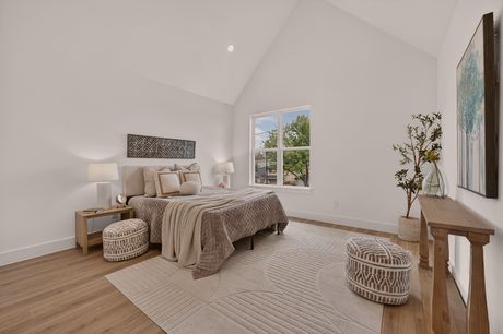 Primary bedroom with vaulted ceiling at Donovan Vista