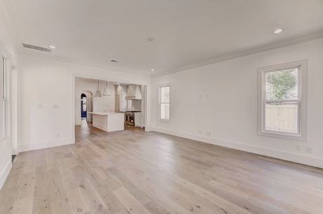 Living area opening to the kitchen at the Stephan Custom Residence