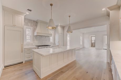 Kitchen with island at the Stephan Custom Residence
