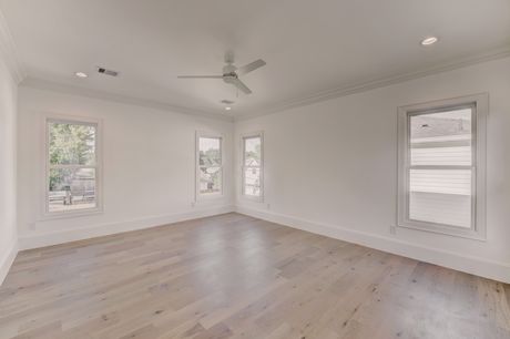 Bedroom with corner windows at the Stephan Custom Residence