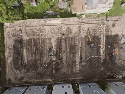 Aerial view of foundation trenching and plumbing rough-in at Residences on 24th