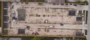 Aerial view of the Mockingbird Place site with multiple building pads staked out