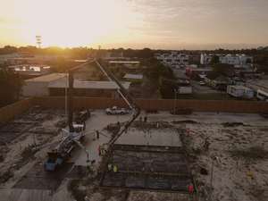Aerial view of a concrete pour underway at sunrise at Mockingbird Place