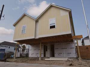 Duplex home with siding installed and twin front entries at Mockingbird Place